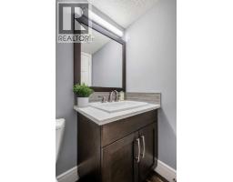2pc Bathroom - 216 Lake Erie Place Se, Calgary, AB T2J2L5 Photo 19