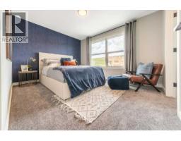 Primary Bedroom - 2104 Lancaster Heights Se, Airdrie, AB T4A3S1 Photo 7
