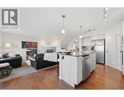 Family room - 113 Drake Landing Heath, Okotoks, AB T1S0G8 Photo 12