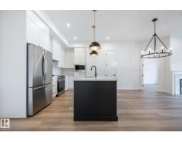 Laundry room - #102 7459 May Common Nw, Edmonton, AB T6R0X6 Photo 6