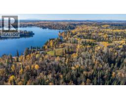 Primary bedroom of 25260 N NESS LAKE ROAD · Prince George, BC