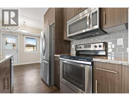 Bedroom - 1921, 2461 Baysprings Link Sw, Airdrie, AB T4B4C6 Photo 7