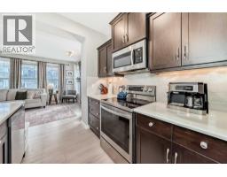 Laundry room - 403 River Heights Crescent, Cochrane, AB T4C0T9 Photo 7
