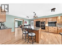 Family room - 34 Tucker Road Se, Airdrie, AB T4A1S8 Photo 9