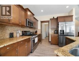 Family room - 417 River Heights Drive, Cochrane, AB T4C0J3 Photo 11