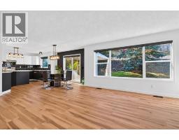 Family room - 45 Bow Ridge Drive, Cochrane, AB T4C1V5 Photo 12