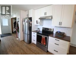 Family room - 5612 57 Street, Taber, AB T1G1L3 Photo 7