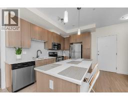 Primary Bedroom - 202, 15233 1 Street Se, Calgary, AB T2X0X5 Photo 6