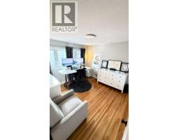 Bedroom - 11204 Wilson Road Se, Calgary, AB T2J2E2 Photo 6
