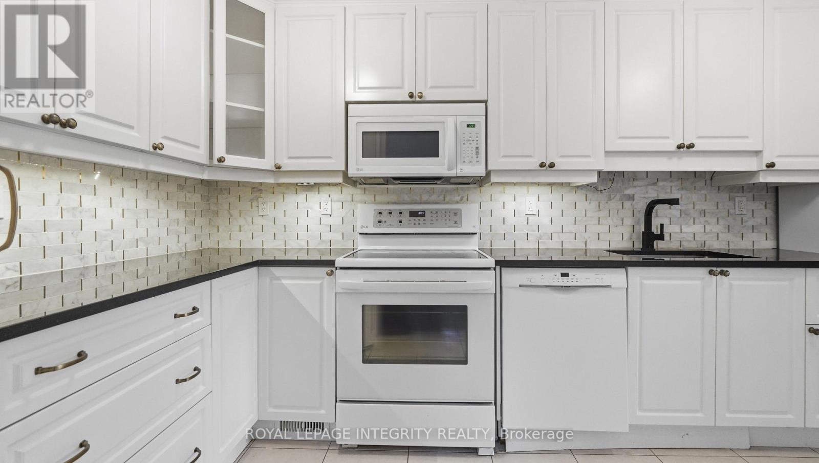 Crisp white kitchen with mosaic backsplash