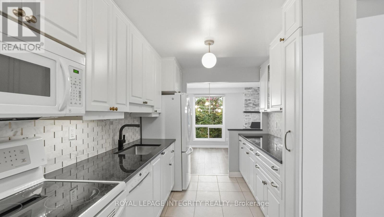 Galley kitchen glowing with natural light