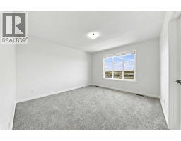 Bedroom - 223 Savanna Way Ne, Calgary, AB T3J0Z9 Photo 11