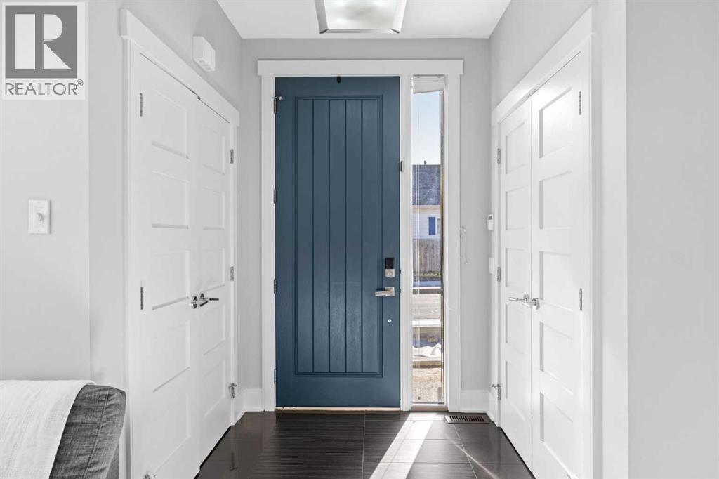 Spacious front entryway with dual closets