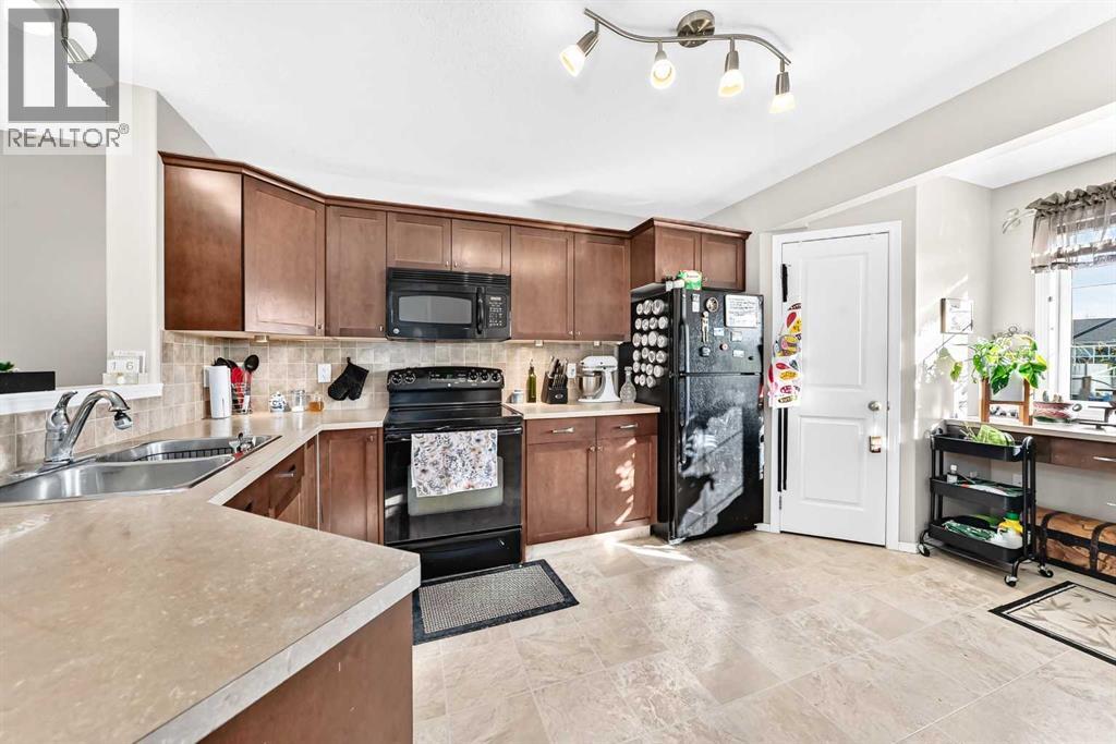 Kitchen is located on the second floor and has a corner pantry