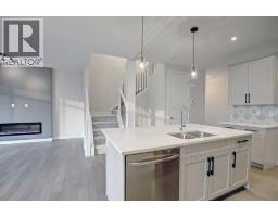 Laundry room - 12 Topaz Place, Cochrane, AB T4C3K2 Photo 11