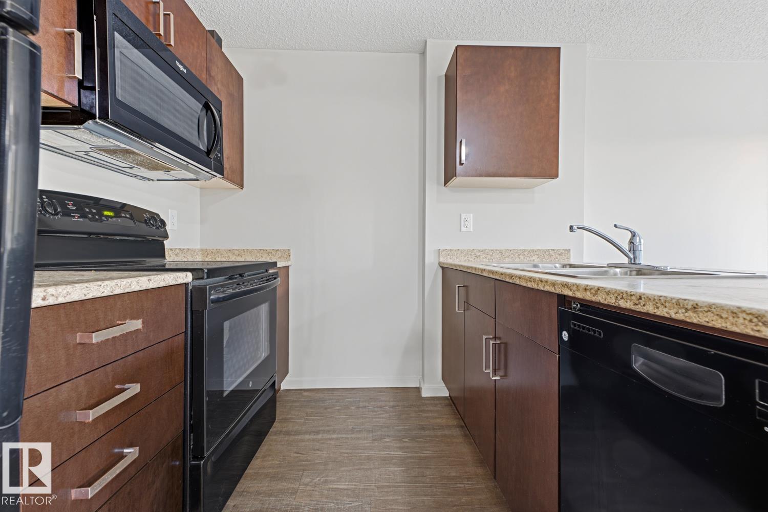 #303 5521 7 AV SW, Edmonton — photo 2