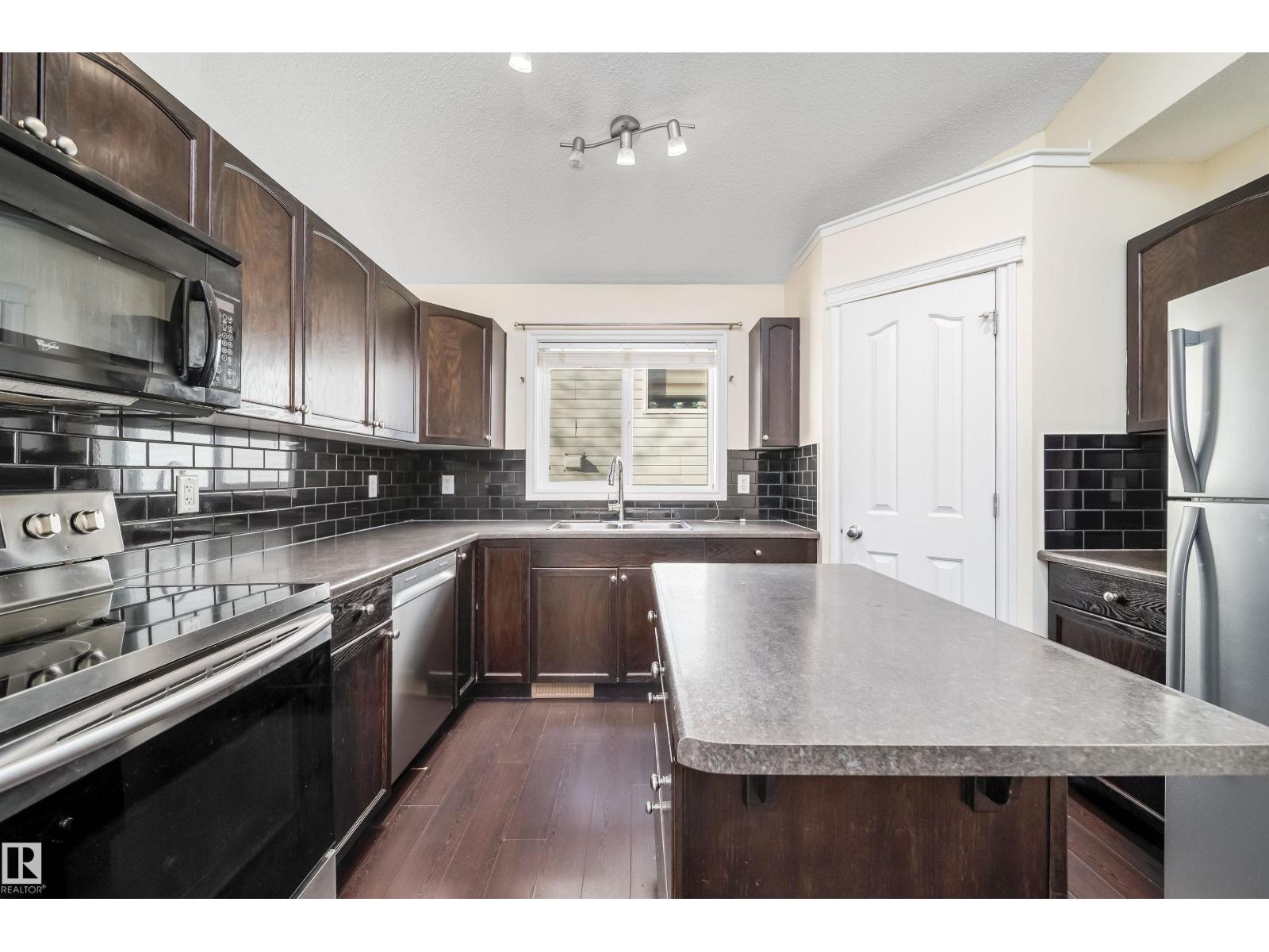 1126 36A Avenue NW, Tamarack — photo 15 of 30: Property photo
