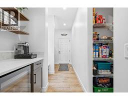 Family room - 129 Wolf Hollow Villas Se, Calgary, AB T2X5K1 Photo 12