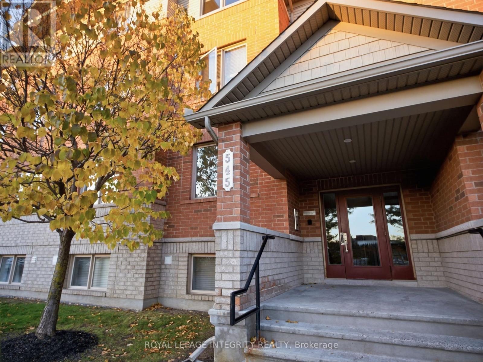 Classic brick building framed by fall colours