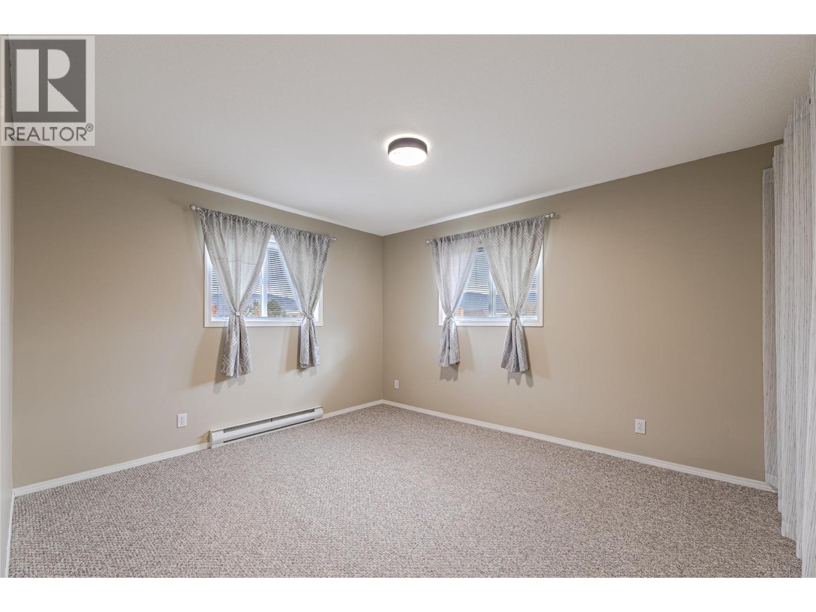 13014 ARMSTRONG Avenue Unit# 208, Summerland