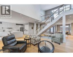 Family room - 18 West Point Mews Sw, Calgary, AB T3H0X4 Photo 12