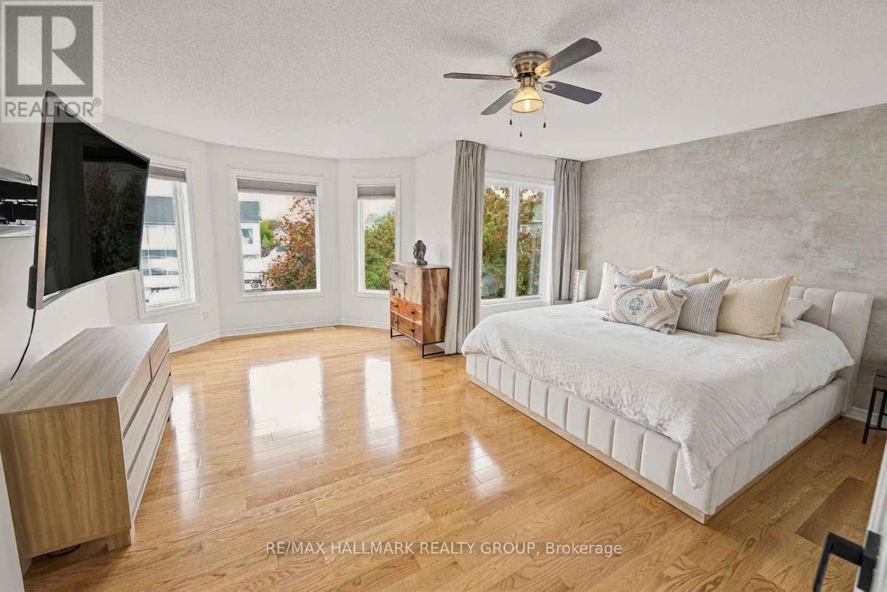 Primary Bedroom with Hardwood Floors and En-Suite
