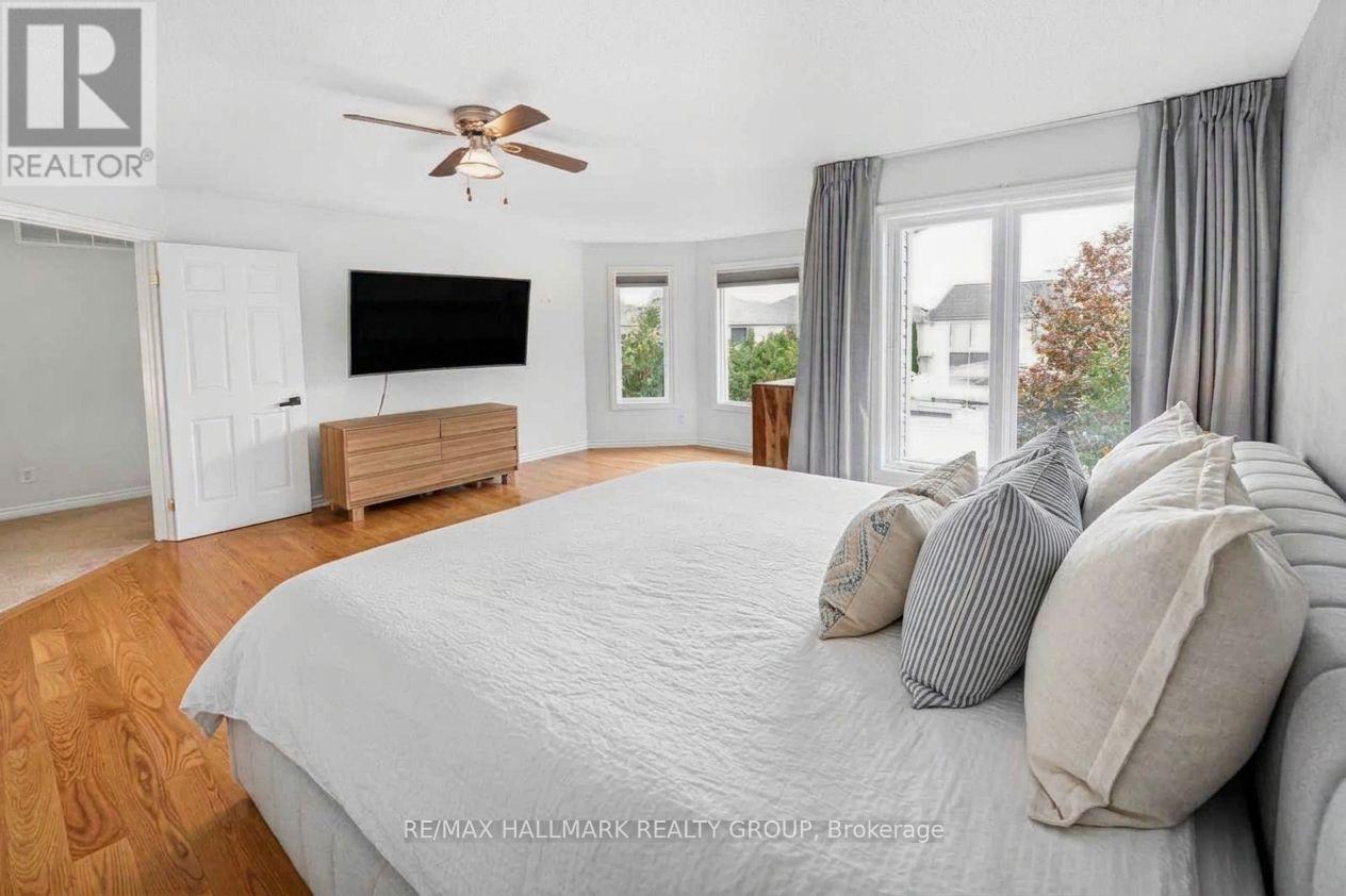 Primary Bedroom with Hardwood Floors and En-Suite