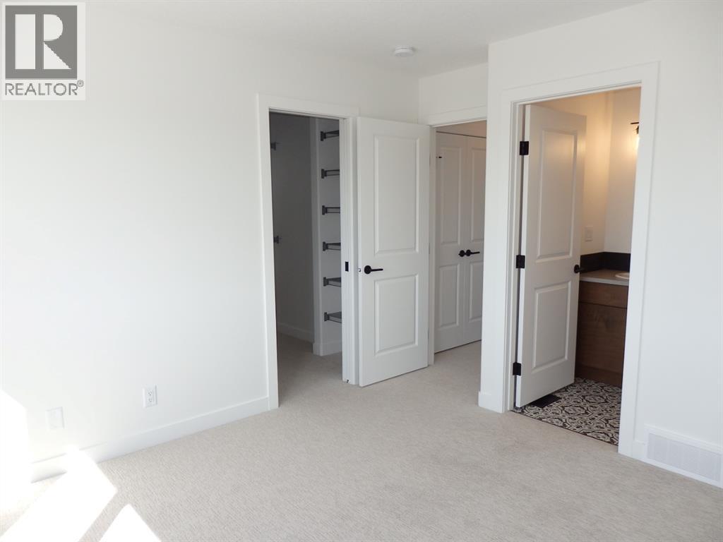 primary bedroom view towards ensuite and closet