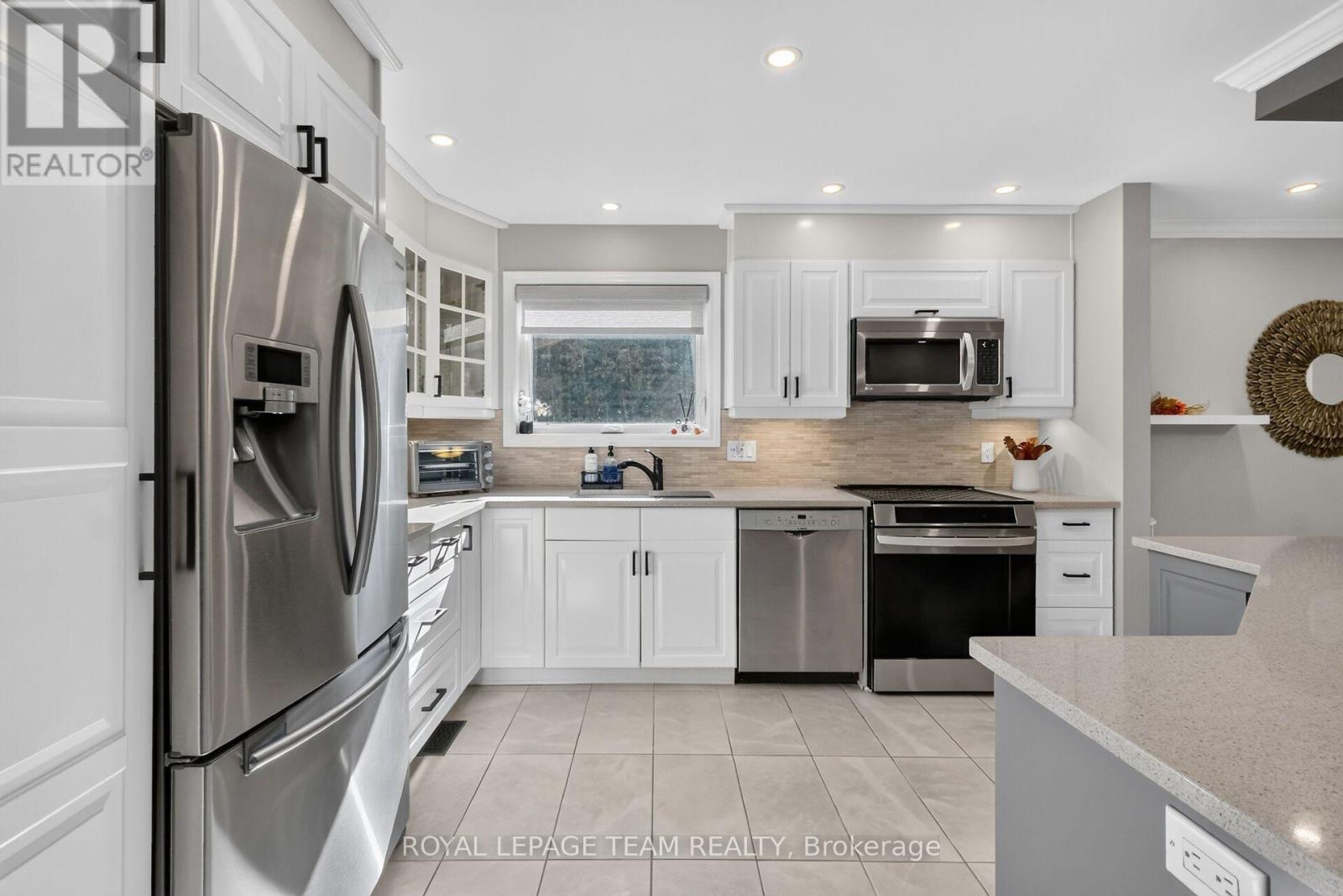 Crisp white cabinetry & SS appliances.