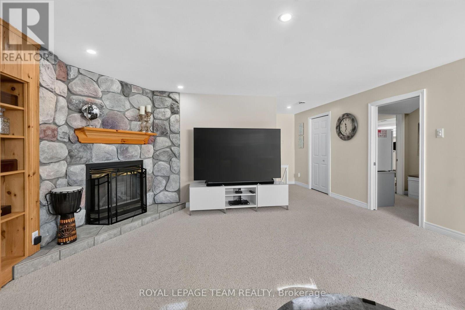 Stone fireplace in fully finished Basement.