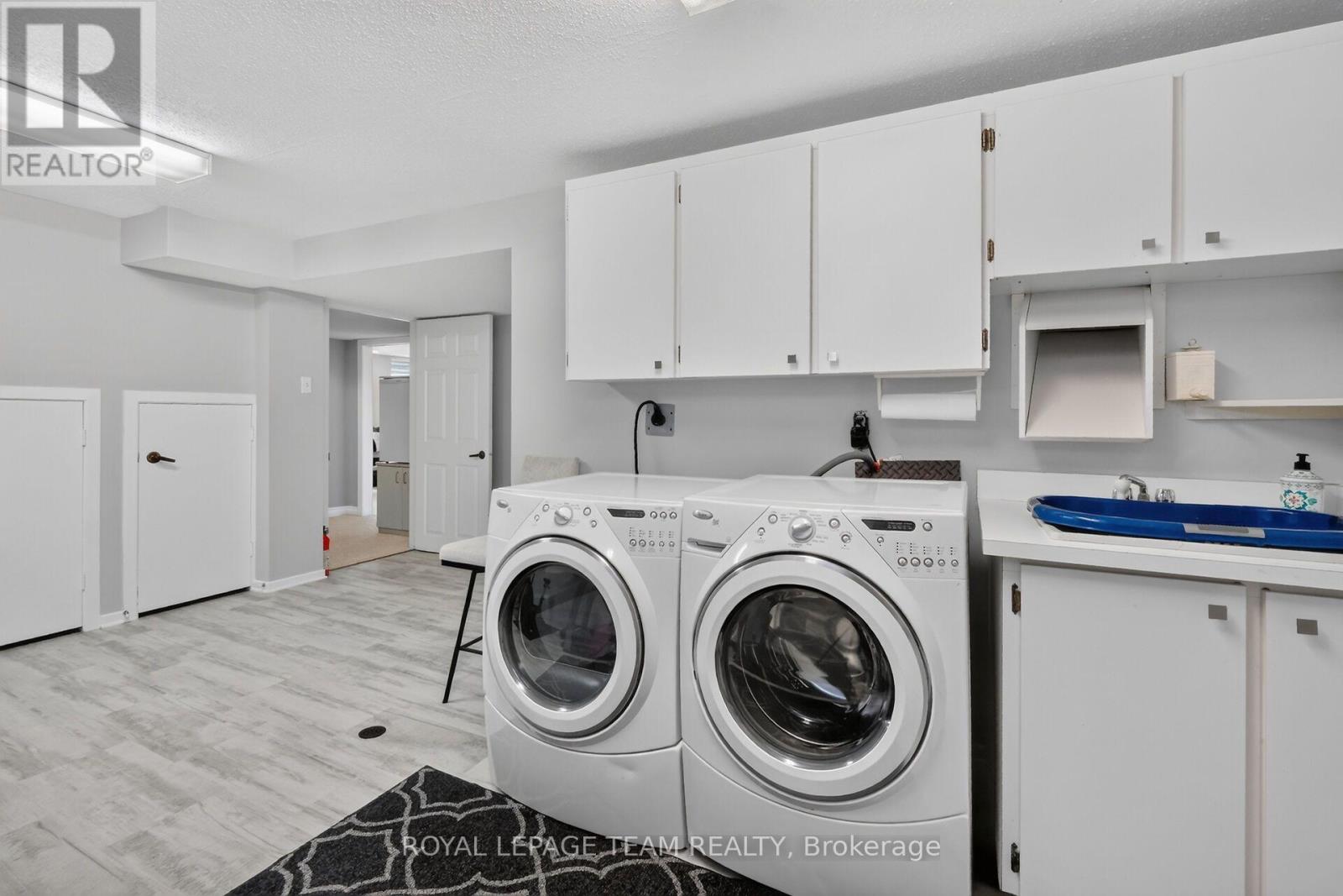 Storage galore in laundry, super bright!