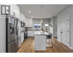 Laundry room - 228 River Heights Drive, Cochrane, AB T4C0W2 Photo 8