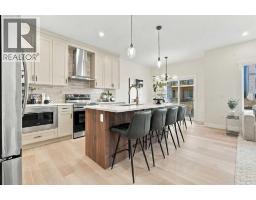 Family room - 99 Heritage Manor, Cochrane, AB T4C3K8 Photo 11