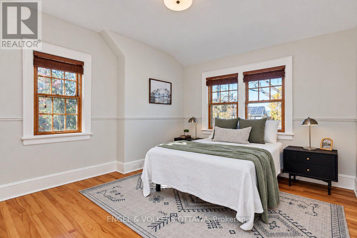 Primary bedroom with windows on both walls