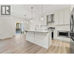 Family room - 111 Heritage Manor, Cochrane, AB T4C3K8 Photo 10