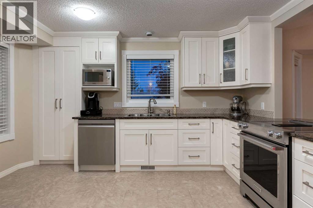 4 ARBOUR CLIFF Court NW, Calgary — photo 9