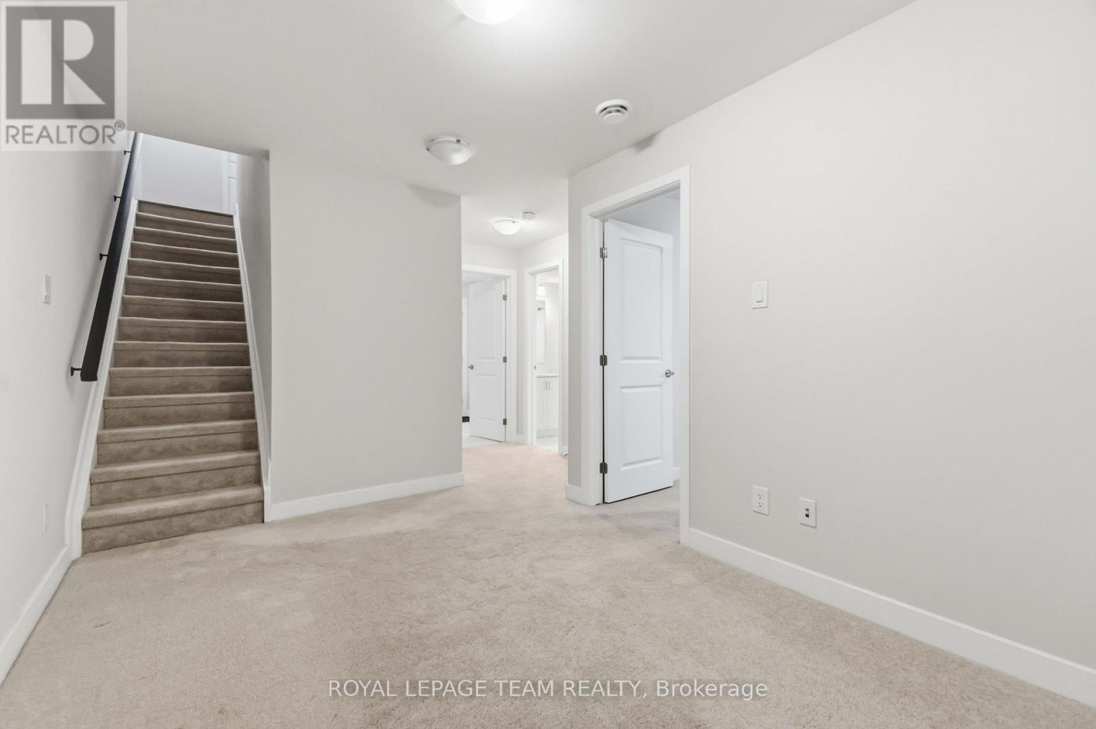 lower level landing open to den