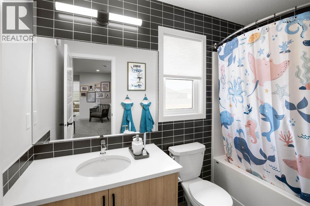 605 Lambeau Link SE, Airdrie — photo 27