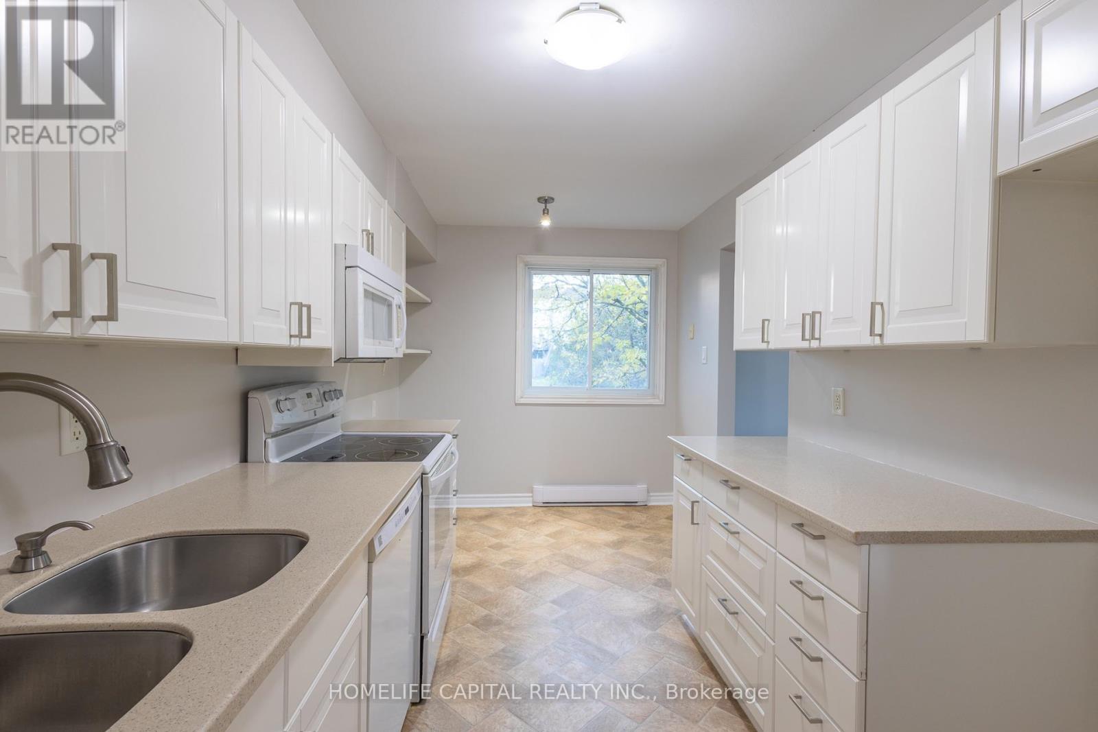 White cabinetry and generous counter space