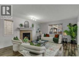 Family room - 105 Saddlecrest Green Ne, Calgary, AB T3J5N5 Photo 10