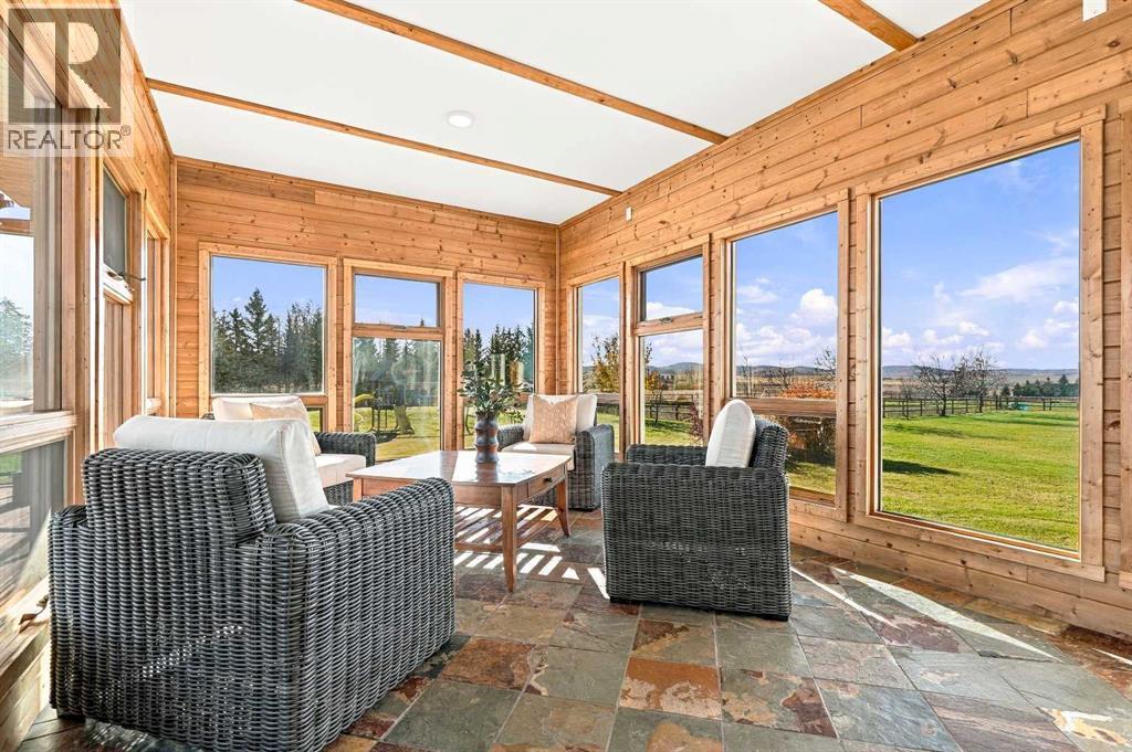 The 3 sided sunroom offers incredible views, sun from all directions, and access to the deck and living room