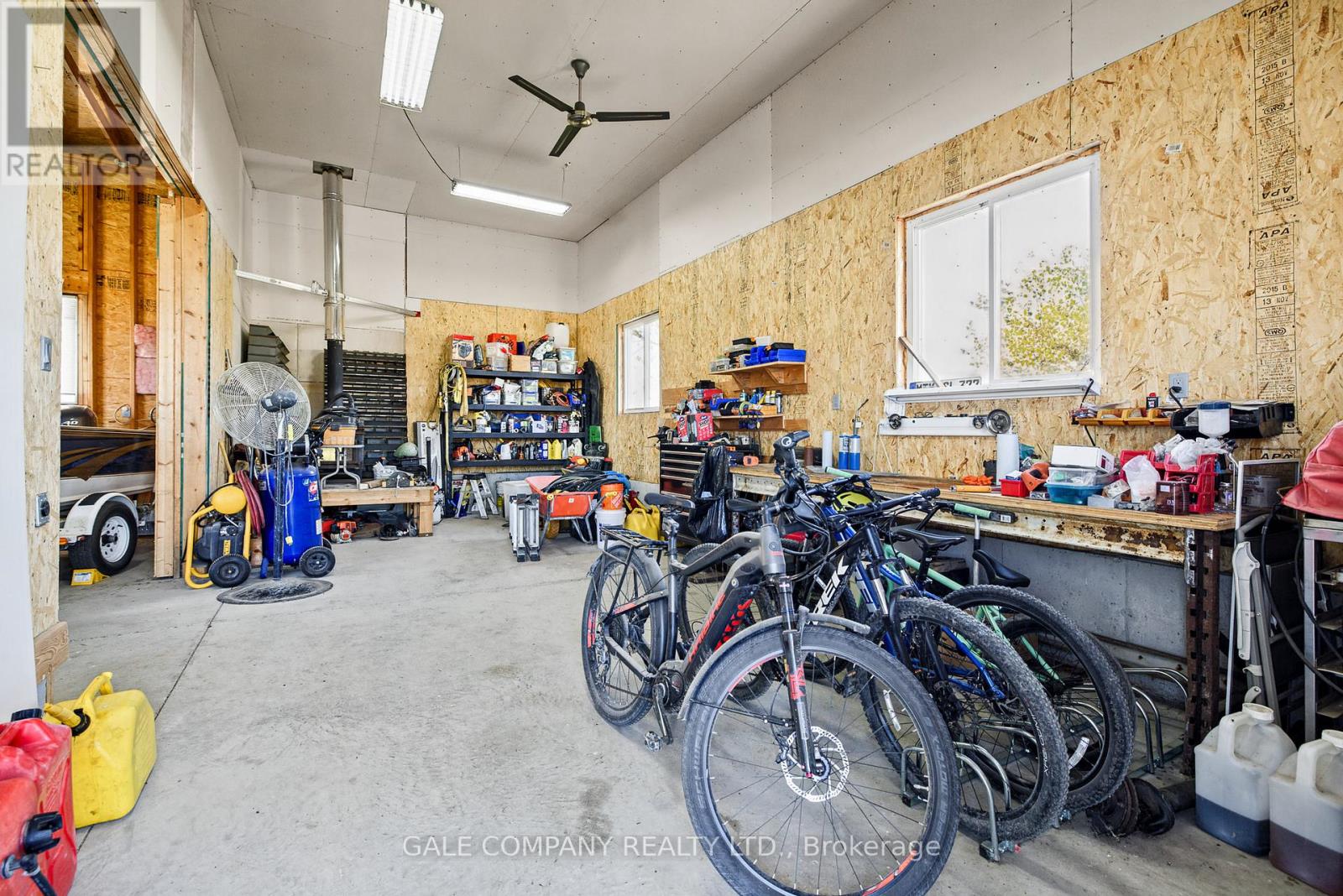 Interior of detached garage with wood stove