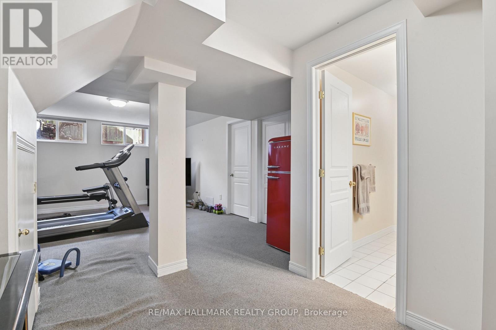 Basement hallway storage under staircase