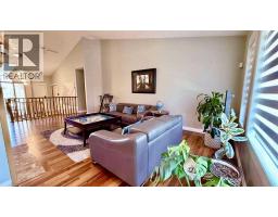 Family room - 11 Hawkmount Heights Nw, Calgary, AB T3G3S4 Photo 11