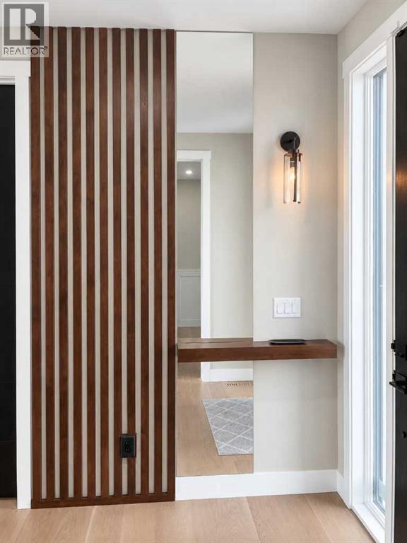 A thoughtfully designed shelf and mirror greet you at the front door