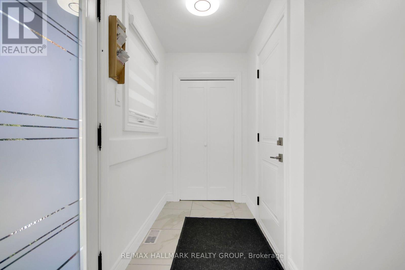 Entry from Garage/Deck with Direct Basement Access