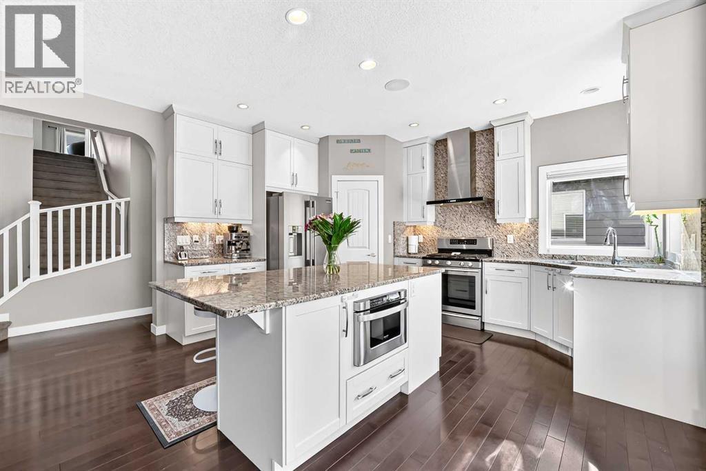 White Cabinetry Extends To The Ceiling