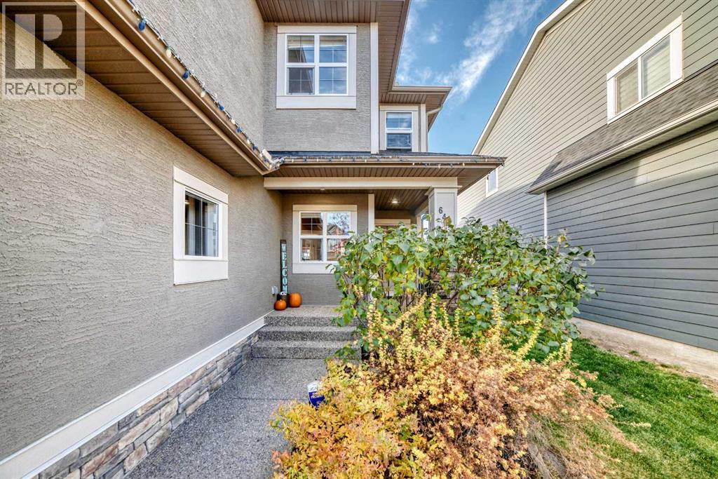 Covered Front Porch With Established Landscaping
