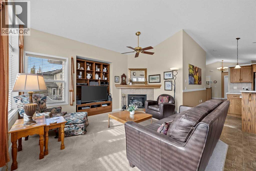 A room made for slowing down. Whether working on a puzzle, catching up with family, or enjoying a quiet evening, the corner fireplace brings warmth to this inviting space