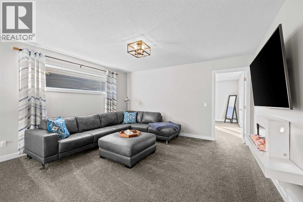 This generous upper-level bonus room gives the family another space to call their own